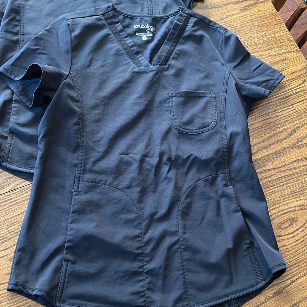 2 black Scrubology tops
